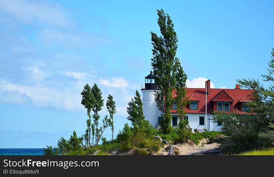 Pt. Betsie lighthouse, lake Michigan, with trees and water