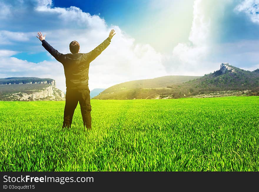 Man in meadow green meadow. Emotional scene.