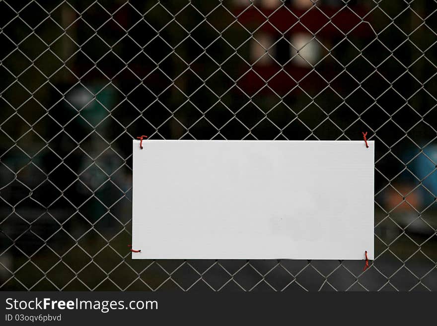 Blank sign on fence