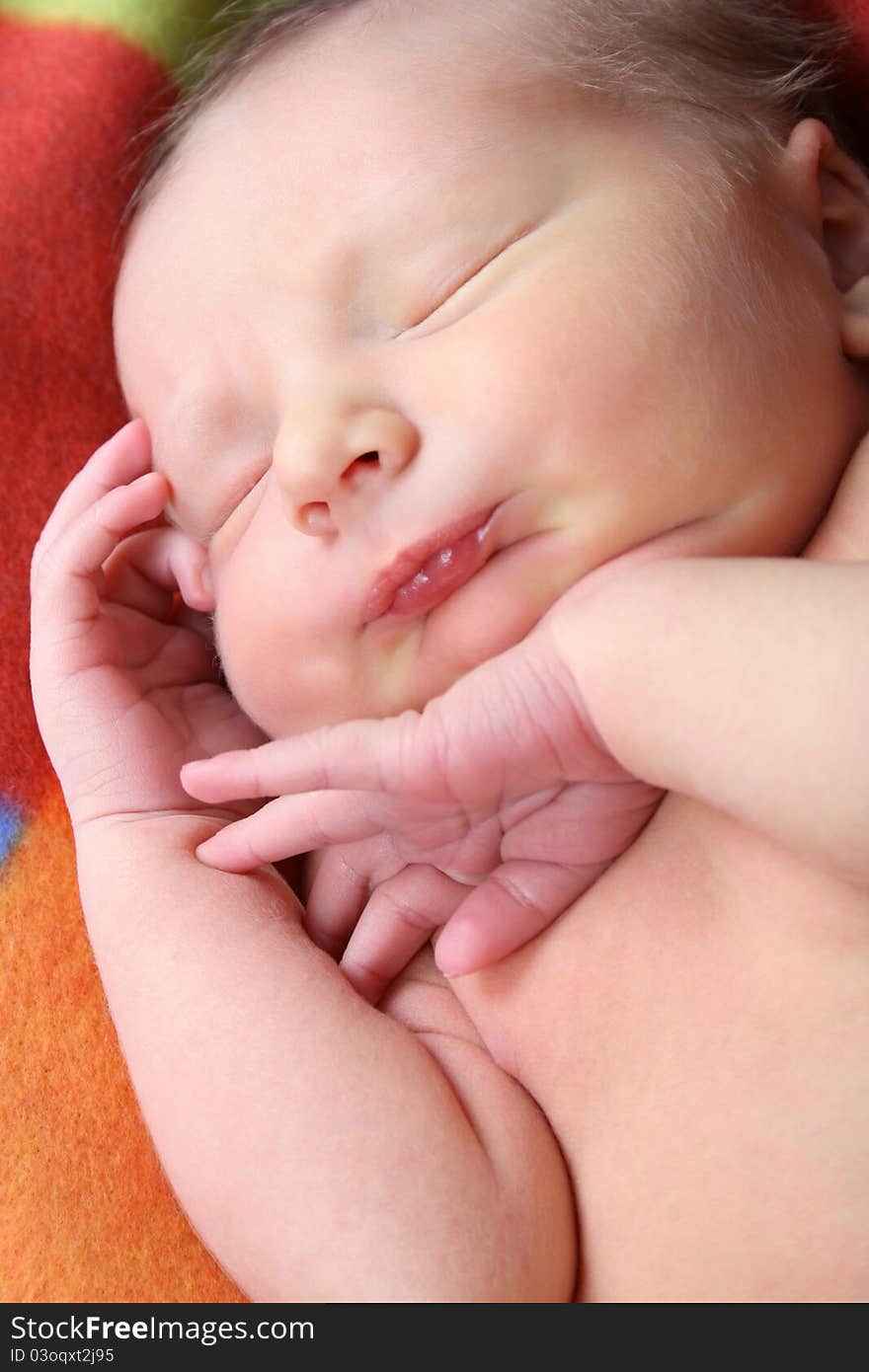 Newborn baby sleeping on a soft blanket. Newborn baby sleeping on a soft blanket