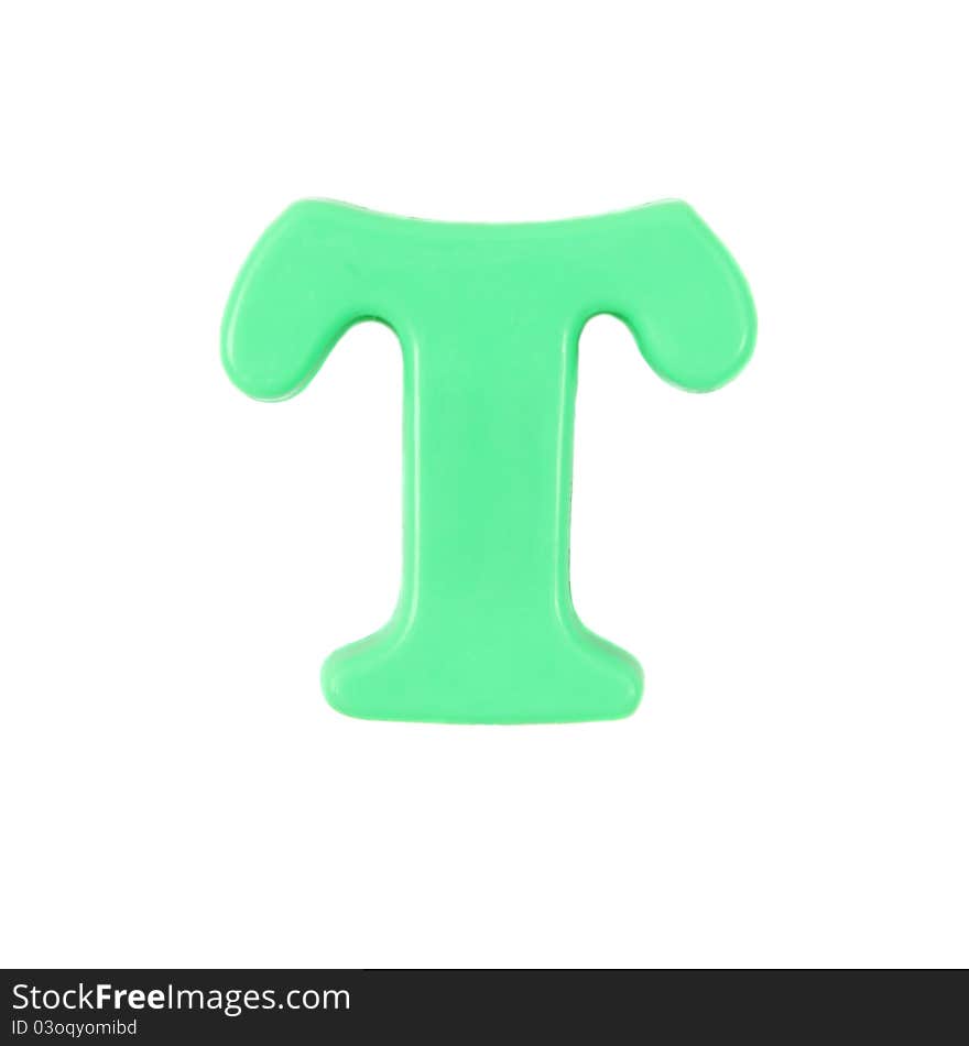 Plastic green letter T on a white background