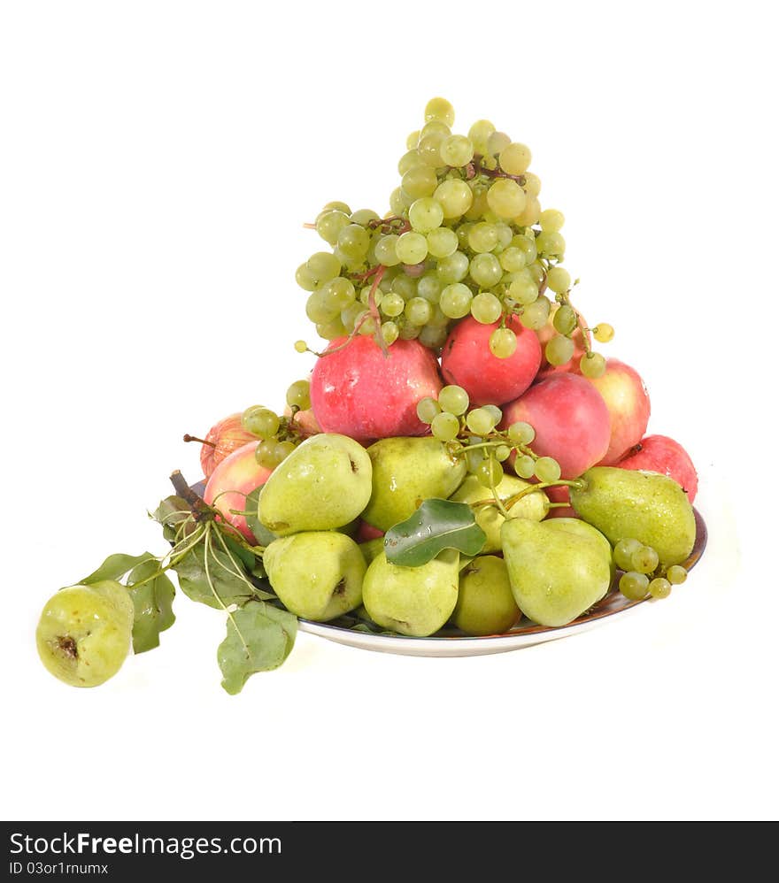 Apples, pears, grapes lie on a plate. Apples, pears, grapes lie on a plate