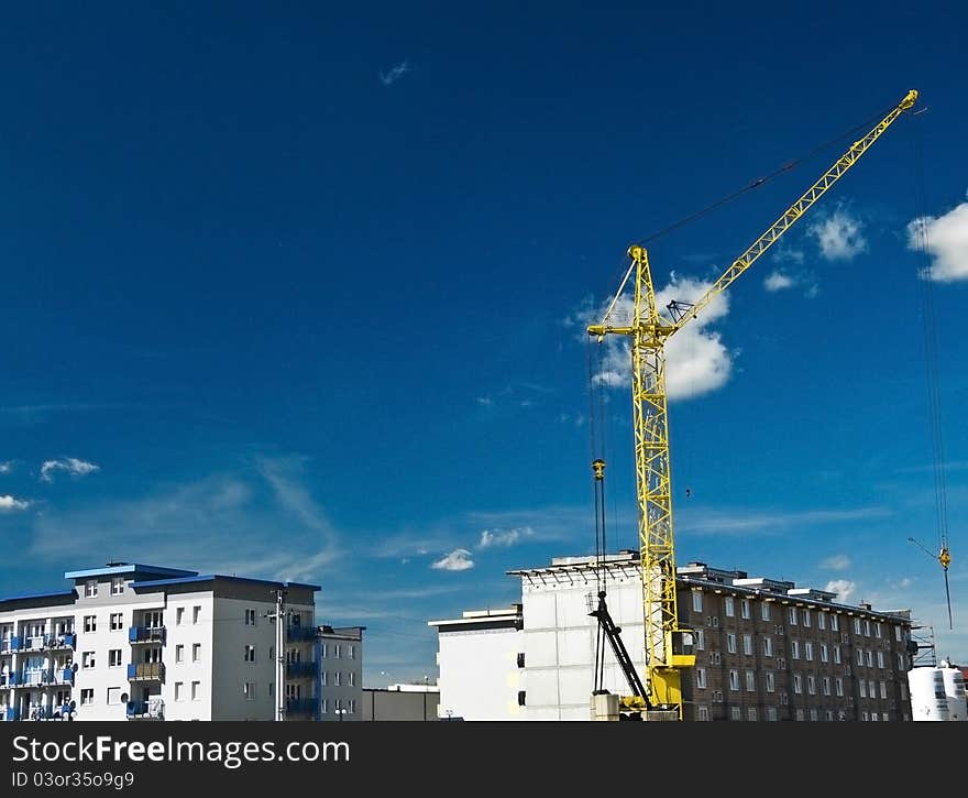 Yellow crane and buildings