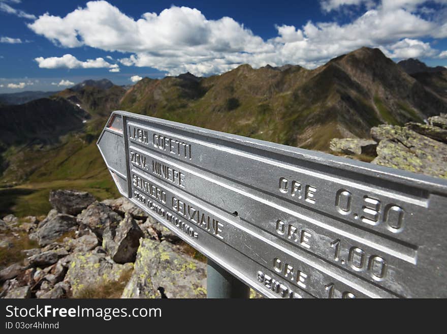 Road signs for hikers and trekkers at 2.500 meters on the sea-level. Italian Alps. Road signs for hikers and trekkers at 2.500 meters on the sea-level. Italian Alps