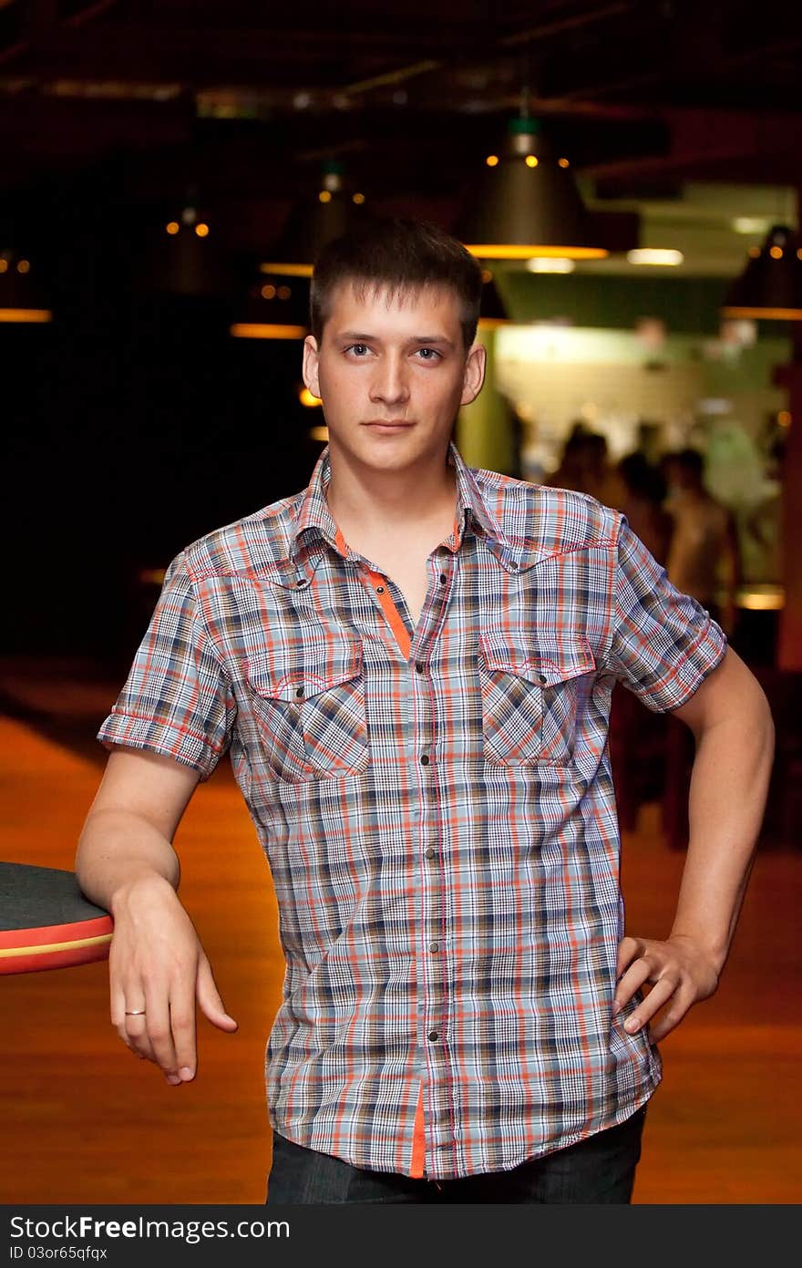 Portrait of a stylish young man in a nightclub