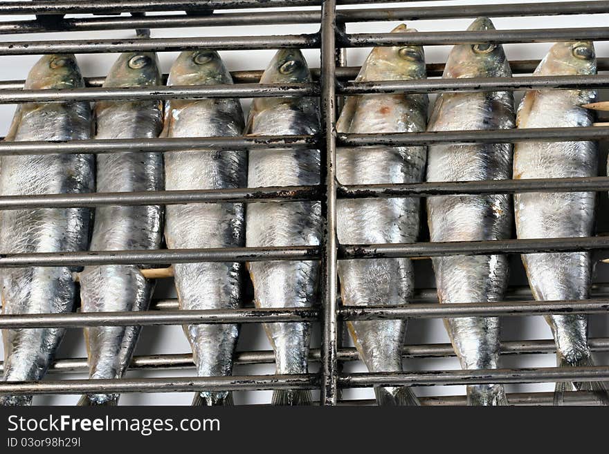 Grilled fish getting ready on charcoal fire