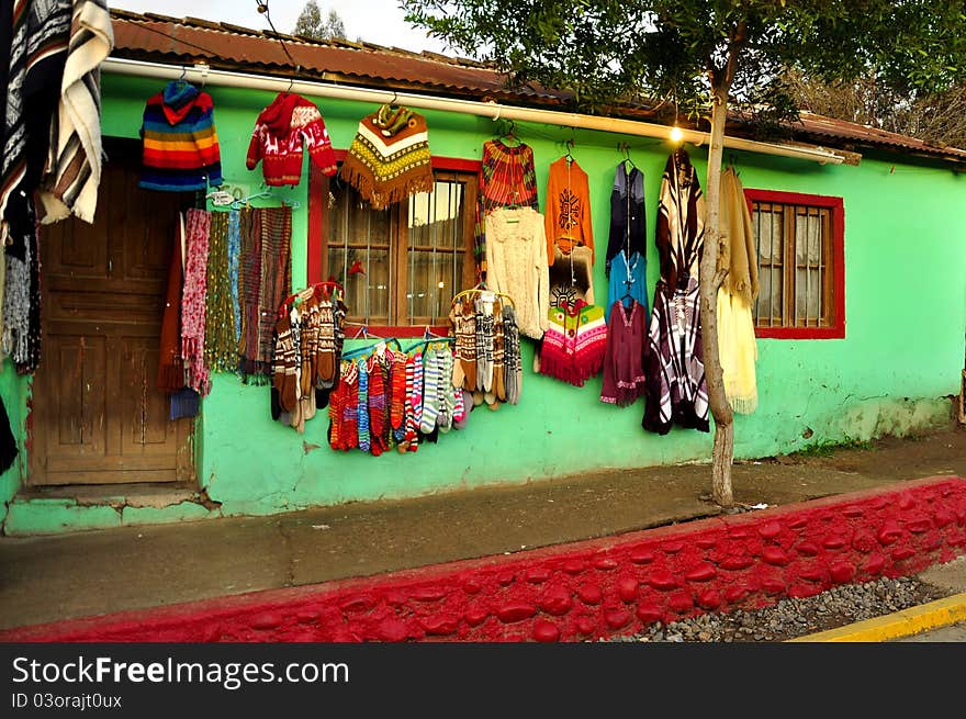 Colorful House With A Sale Of Clothes