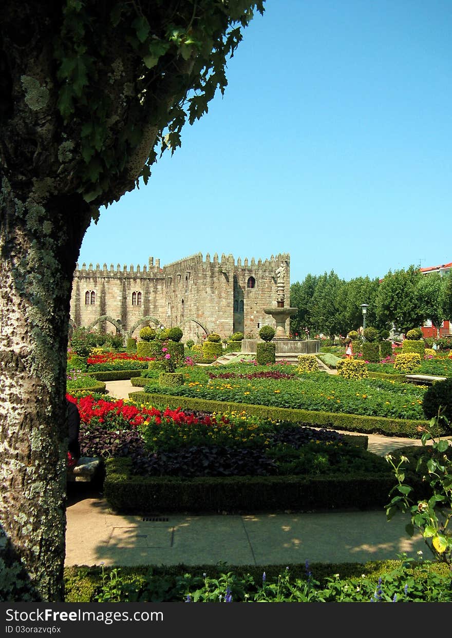 A view of the Jardim de Santa Barbara, a garden full of flowers on the back of the old episcopal palace (that can be seen on the background), today used as library