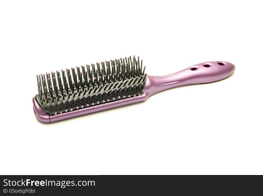 An image of a red hairbrush