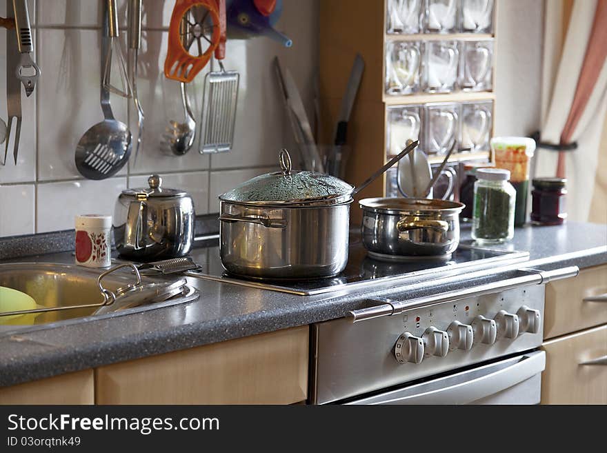 Preparing lunch for the family. cooking in a modern kitchen. Preparing lunch for the family. cooking in a modern kitchen.