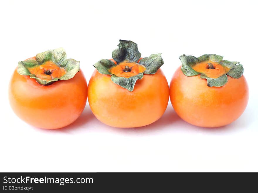 A persimmon is the edible fruit of a number of species of trees in the genus Diospyros in the ebony wood family. A persimmon is the edible fruit of a number of species of trees in the genus Diospyros in the ebony wood family