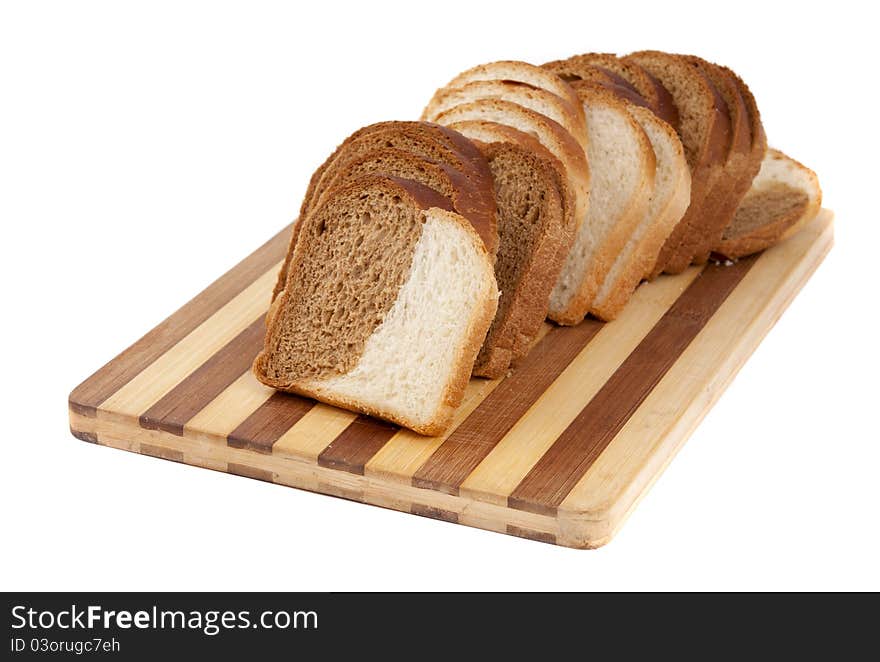 Sliced bread on a board on a white background