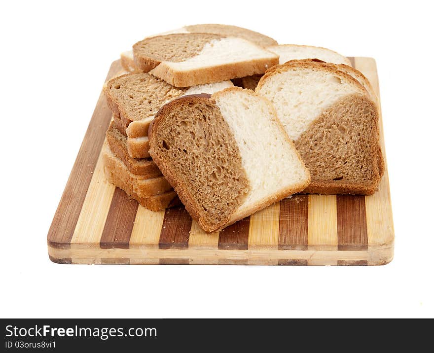 Sliced bread on a board on a white background