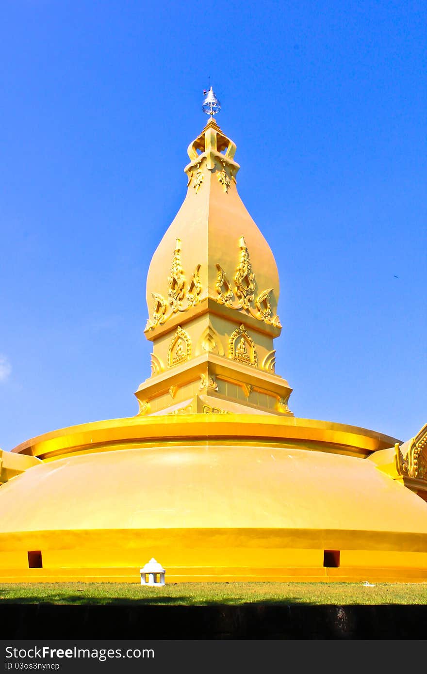 Golden pagoda with blue sky at side view