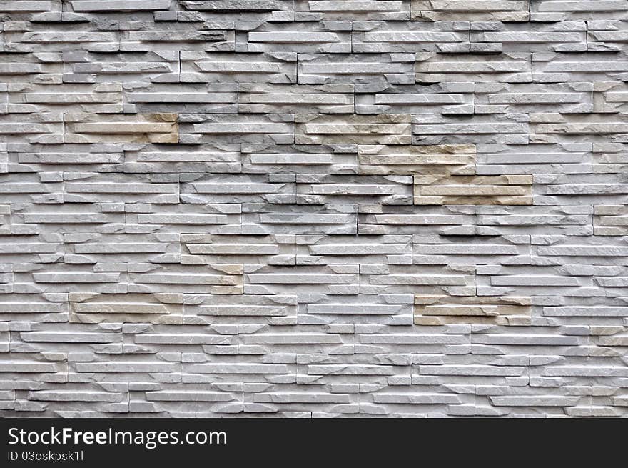 Stone wall background (decorated in garden).