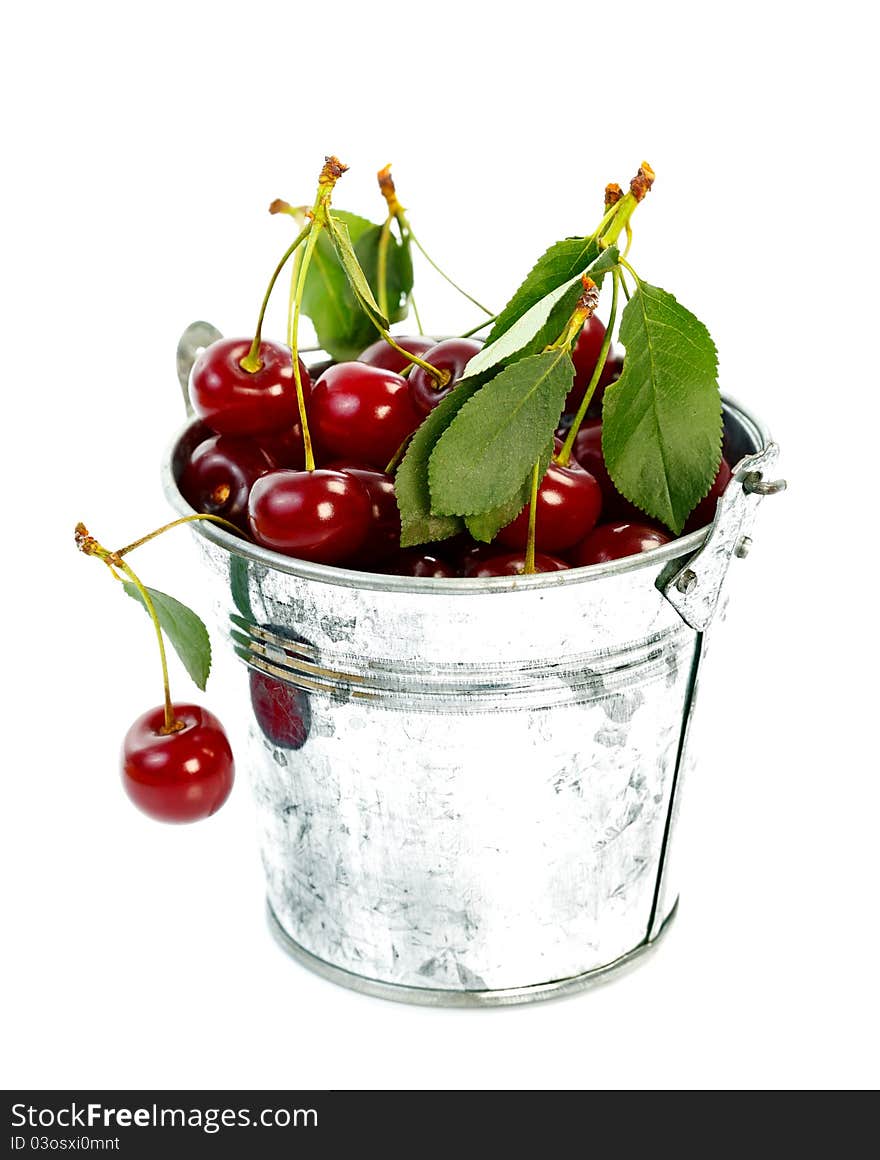 Pot full with fresh sour cherries over white background. Pot full with fresh sour cherries over white background