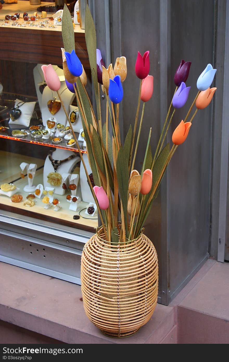 Artificial Tulips in a cane vase next to a jewelery shop in Heidelberg, Germany, Europe