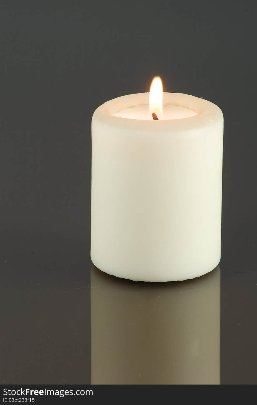 Isolated candle in the dark background. Isolated candle in the dark background