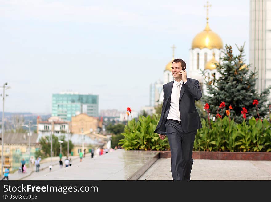 Young man with mobile phone outdoors. Young man with mobile phone outdoors