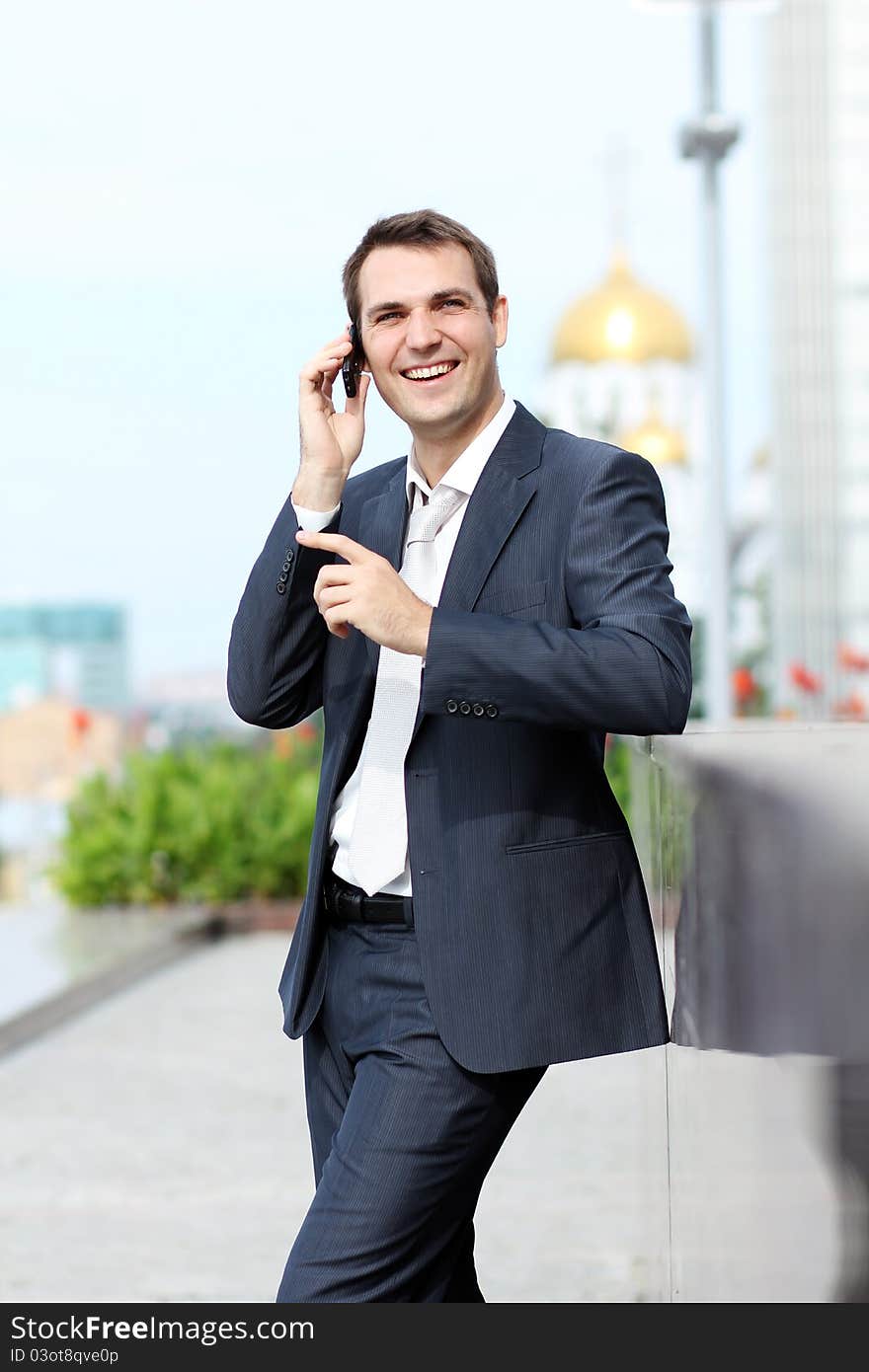 Young man with mobile phone outdoors. Young man with mobile phone outdoors