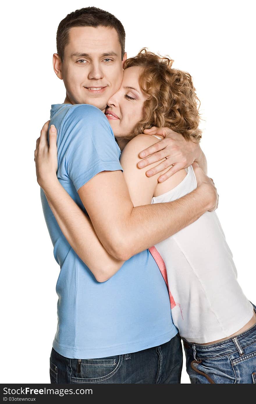 Portrait of a beautiful young happy smiling couple - isolated