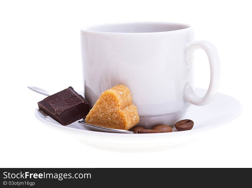 Coffee beans and cup isolated on white