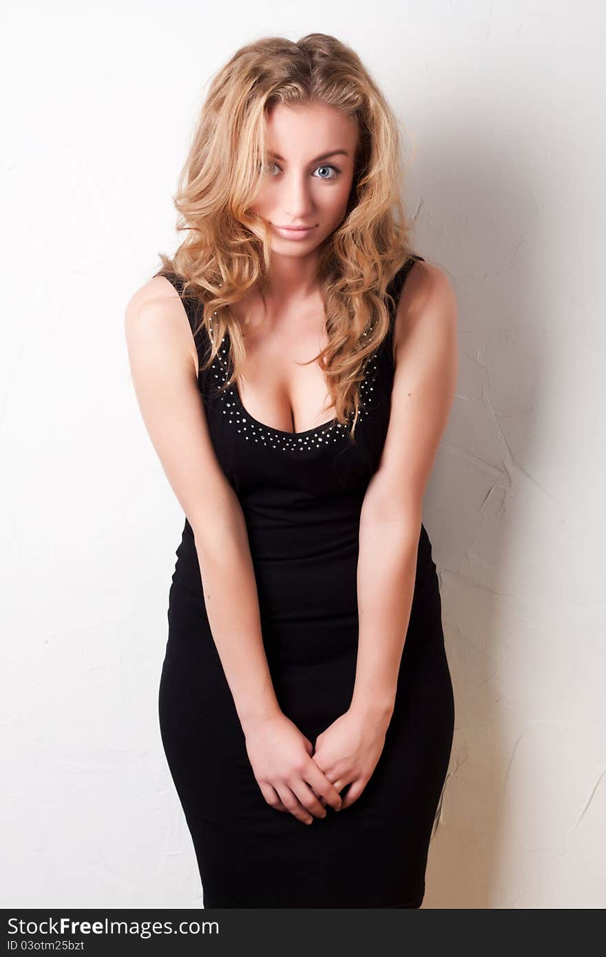 Cute blond girl in a beautiful black dress. Cute blond girl in a beautiful black dress