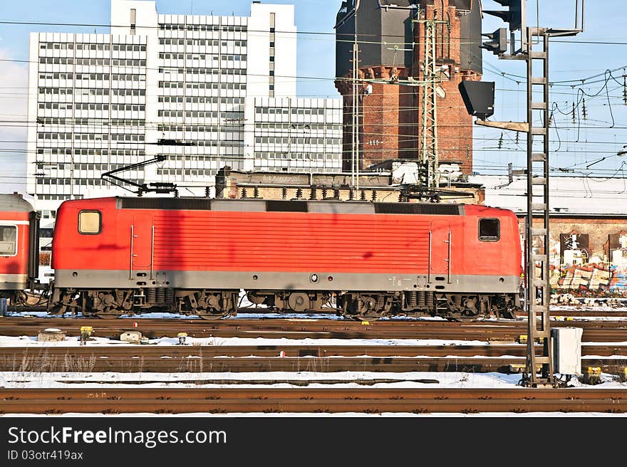 Red railway in motion in the station