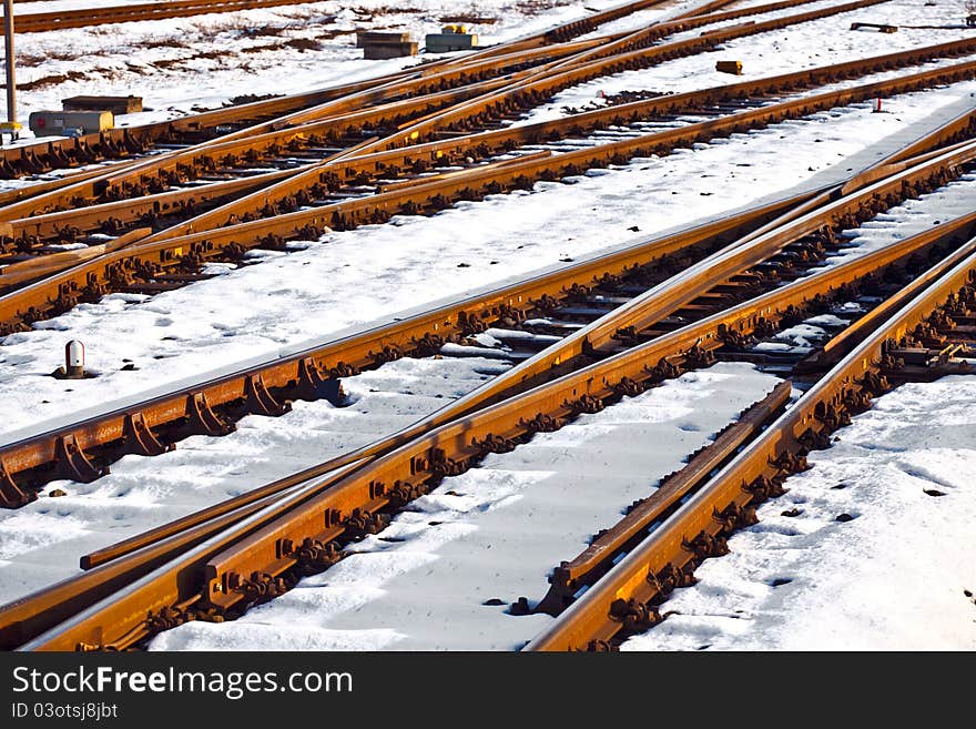 Rails in winter at the station covered with snow