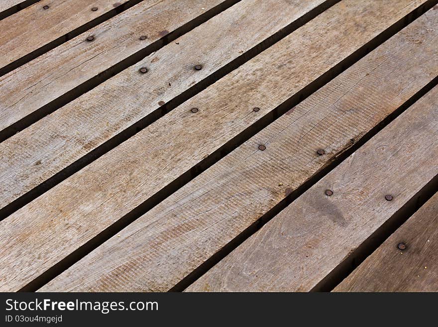 Patterns and textures of a wooden planks pavement