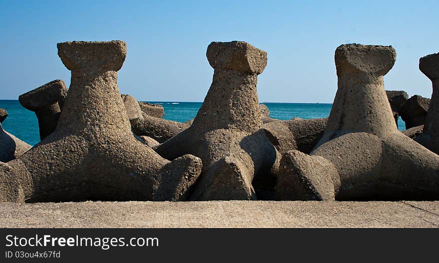 Storm protection structures at seashore, used to break large waves