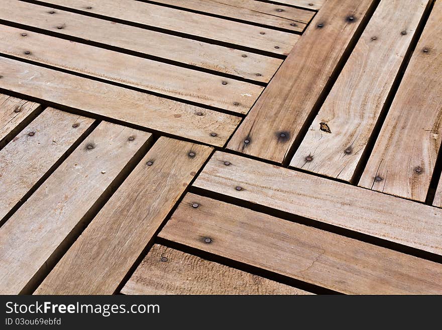 Patterns and textures of a wooden planks pavement