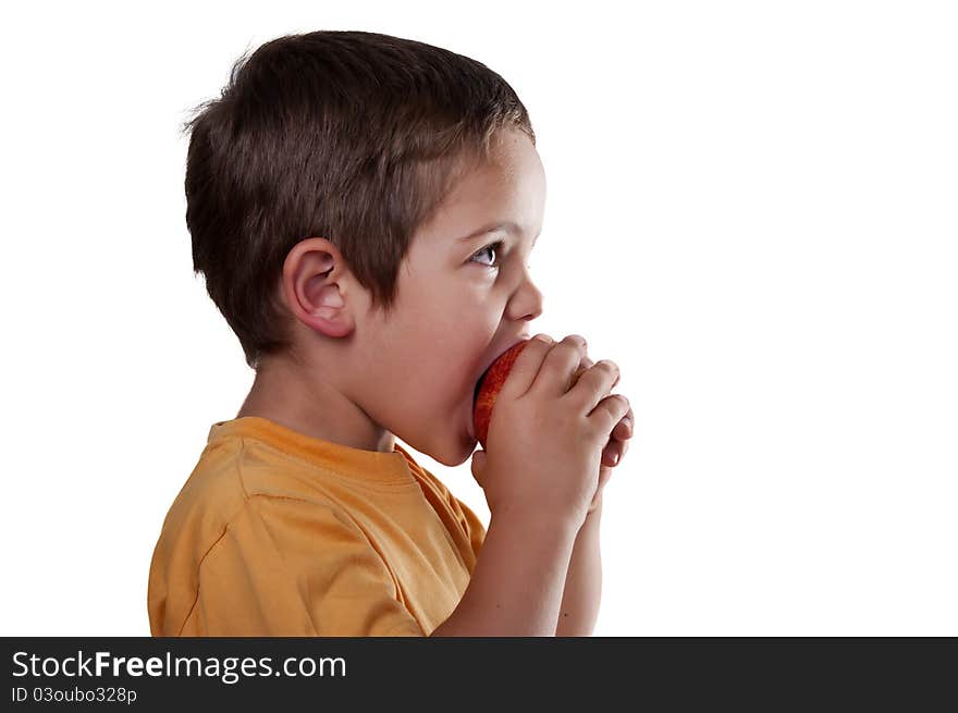 Child eating an apple on white background