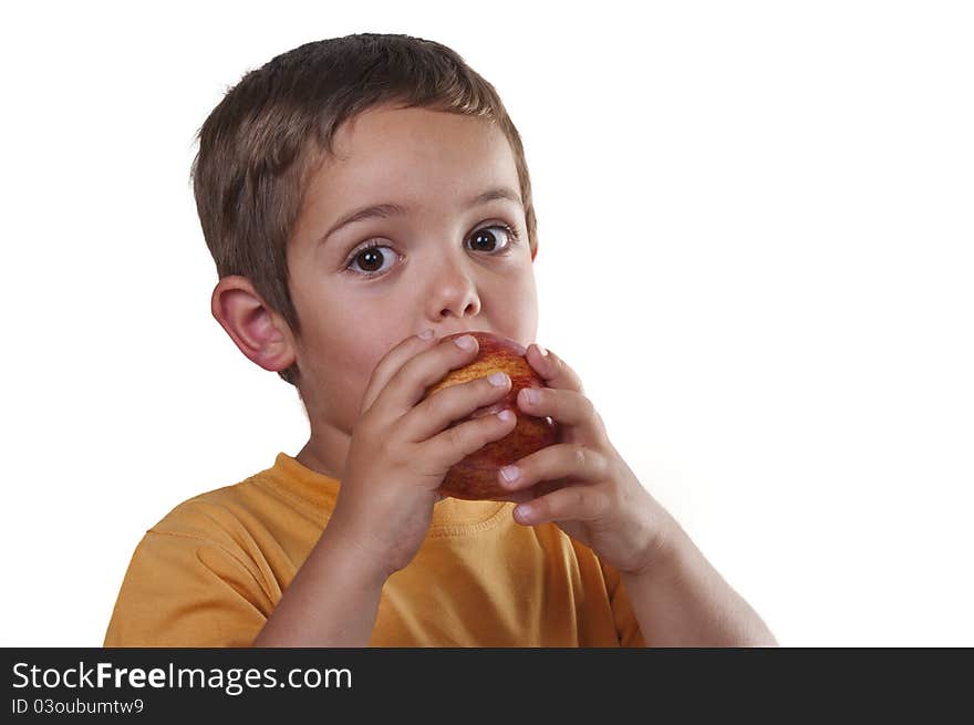 Child eating an apple on white background