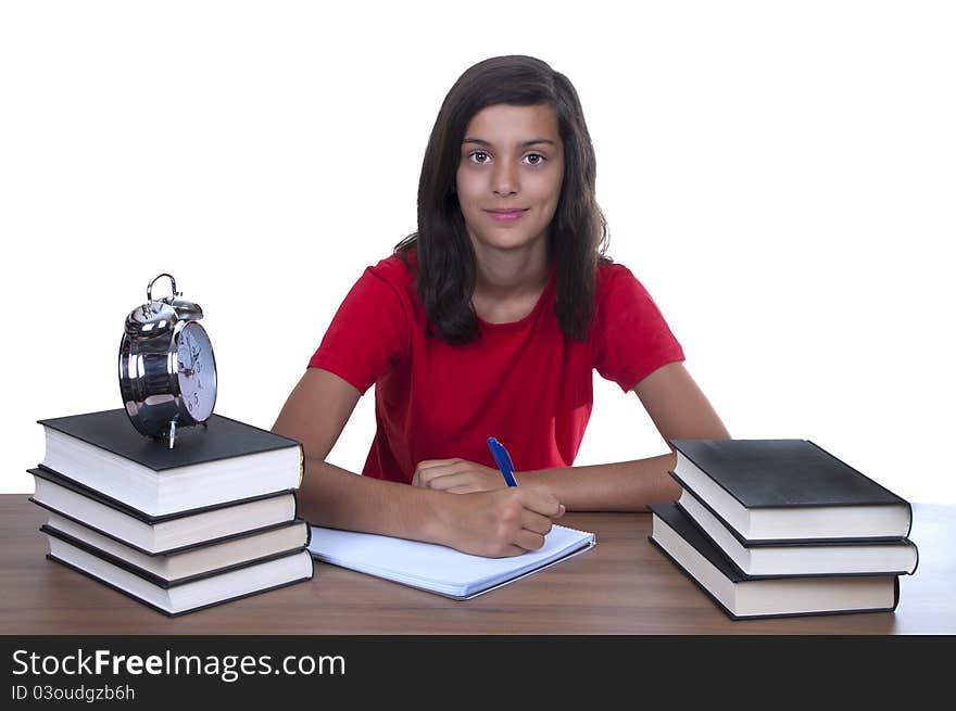 Teenage girl studying on her desk