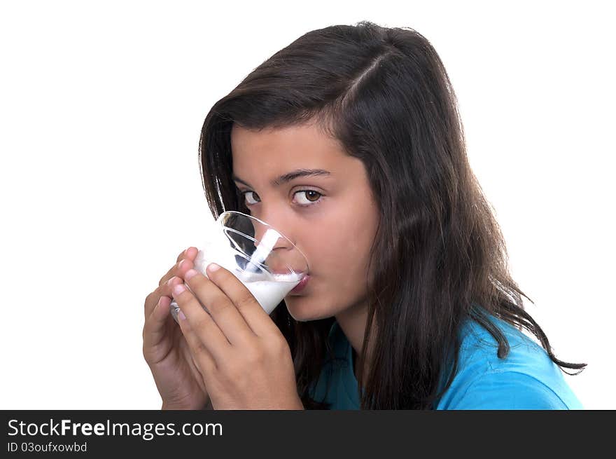 Teenage girl with glass of milk on white background