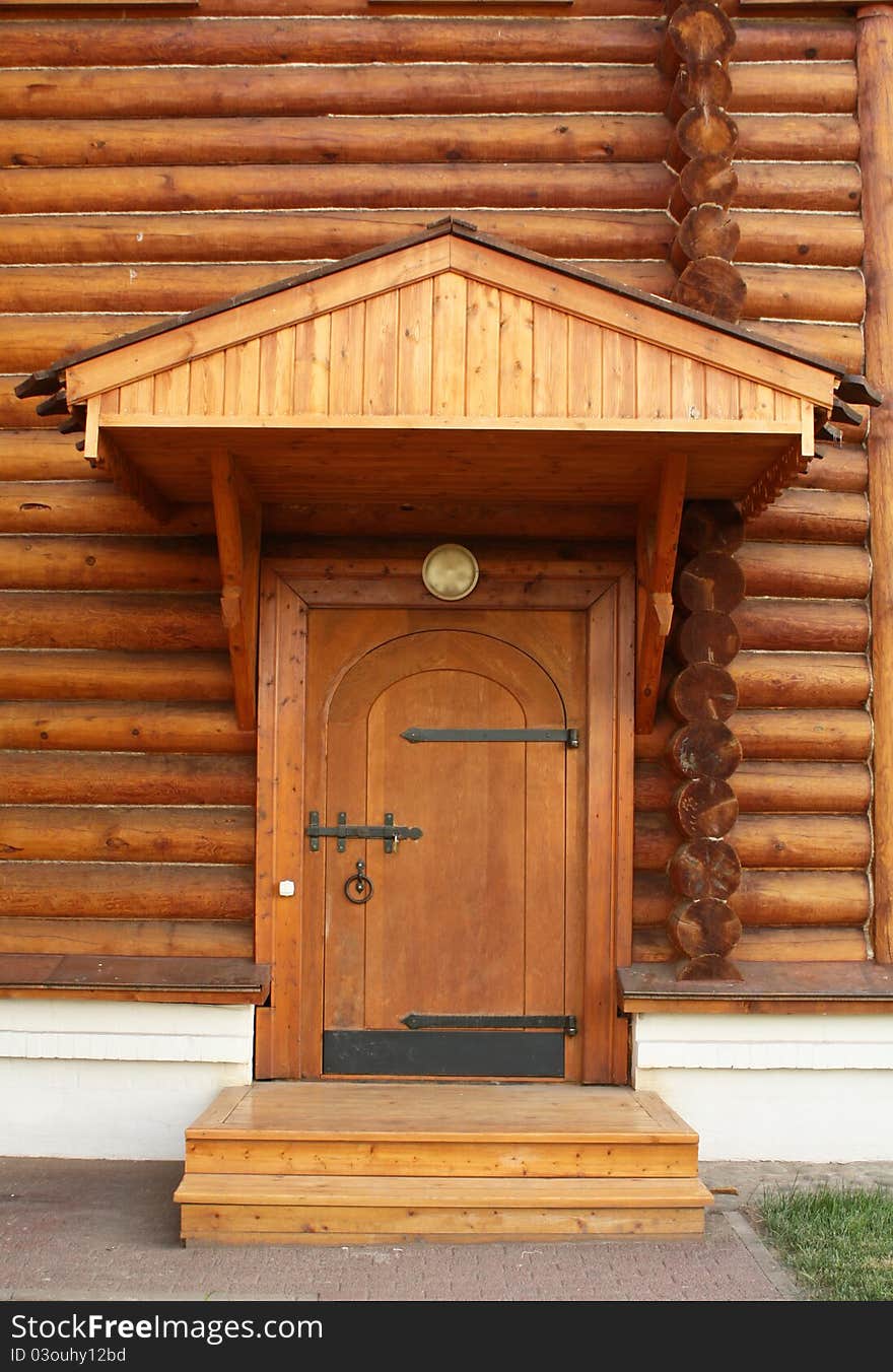 Wooden house built in the traditional russian style of the eighteenth sentury. The entrance. Wooden house built in the traditional russian style of the eighteenth sentury. The entrance