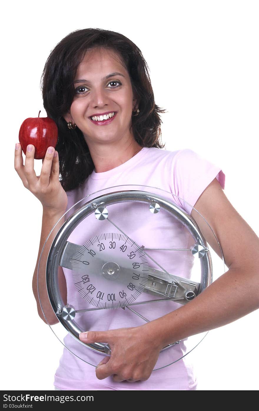 Woman with weigh and apple on white background