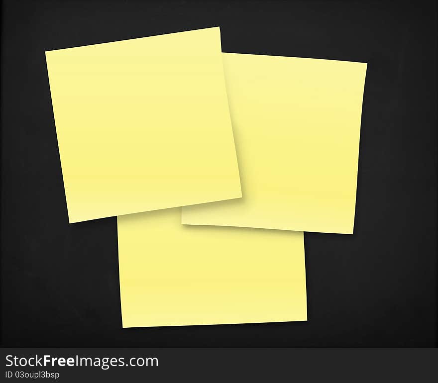 3 yellow notes on a black textured board. 3 yellow notes on a black textured board.