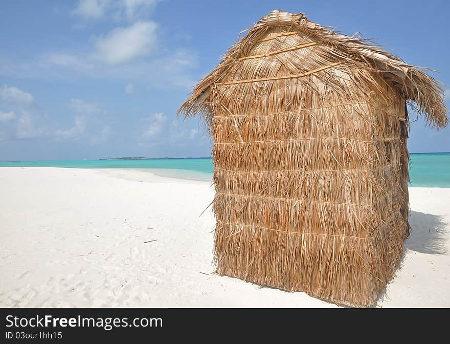 Grass hut on a tropical island in the indian ocean. Grass hut on a tropical island in the indian ocean