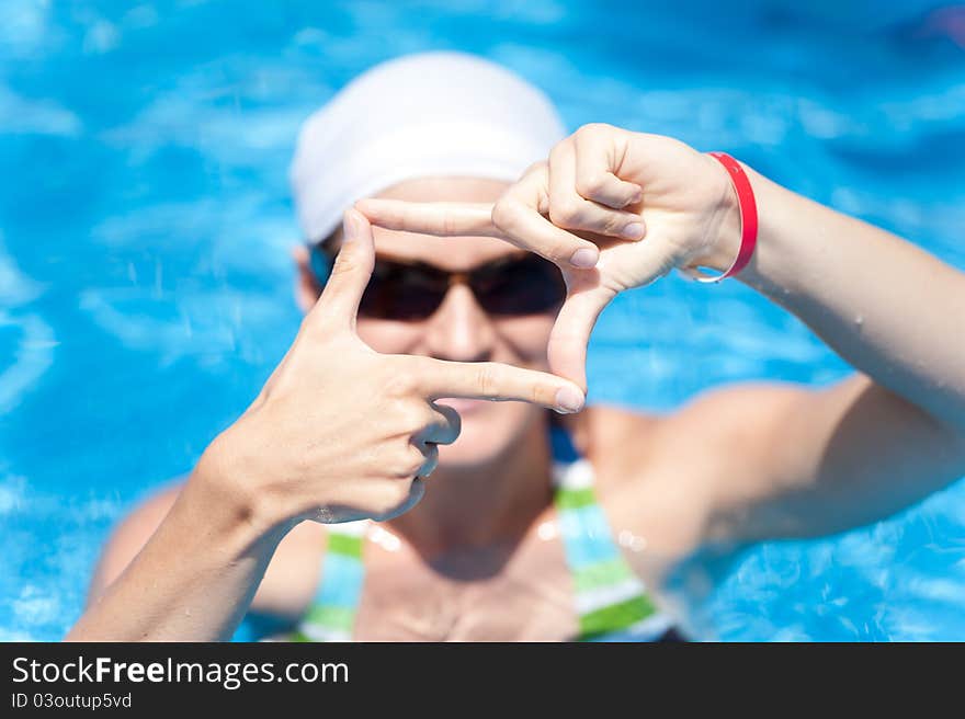 Woman is swimming in pool. Woman is swimming in pool