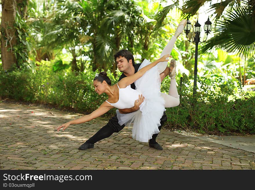 Couple performing ballet in the park