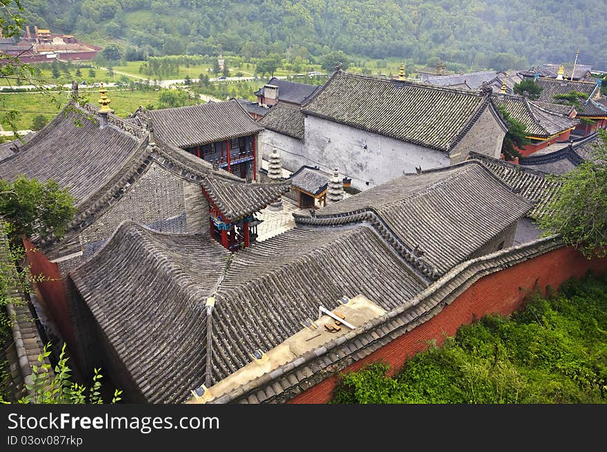 An aerial view over chinese tiles roofs in an ancient chinese village of mount wutai in shanxi province.