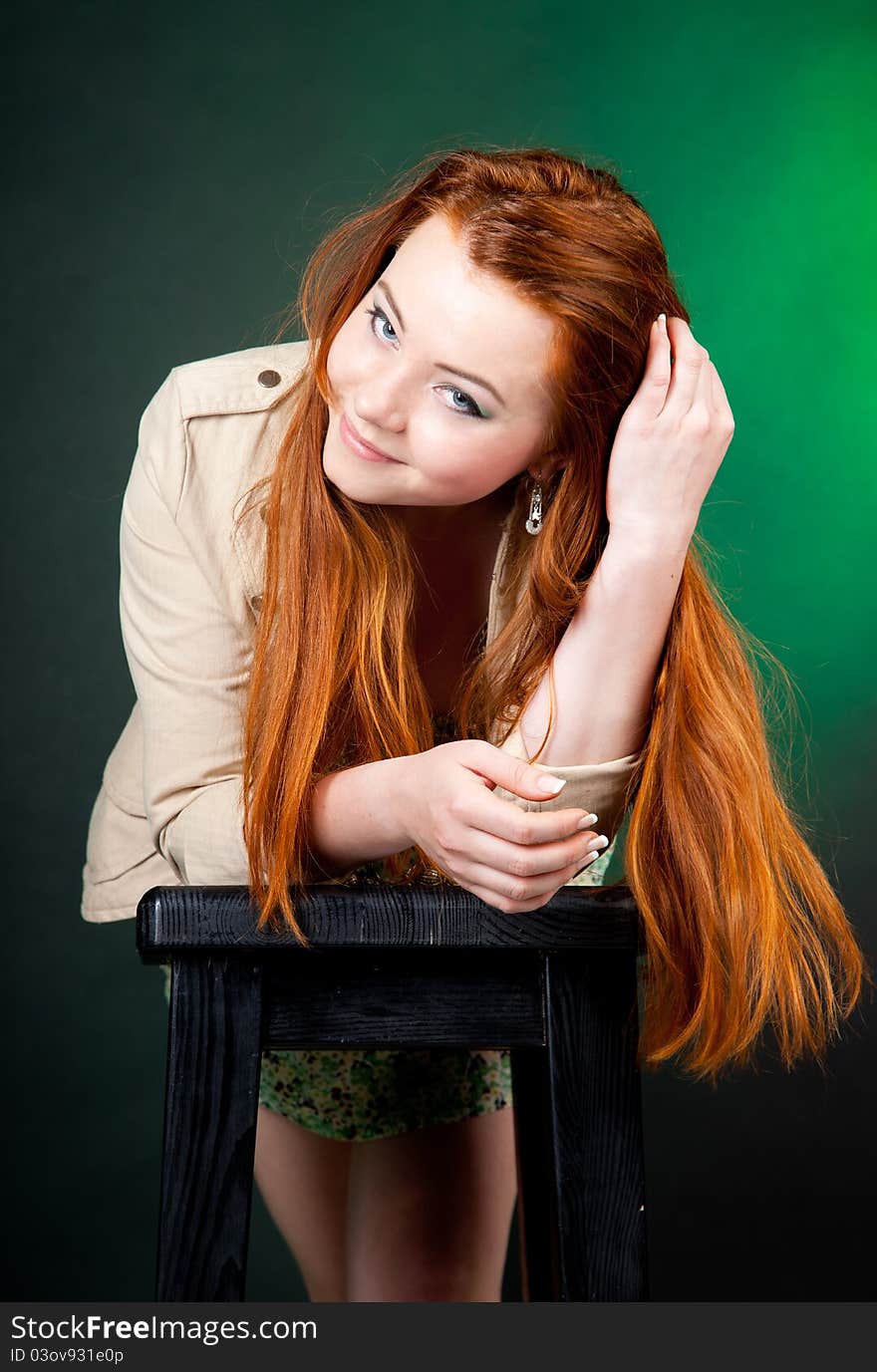 Studio shot of beautiful red haired woman