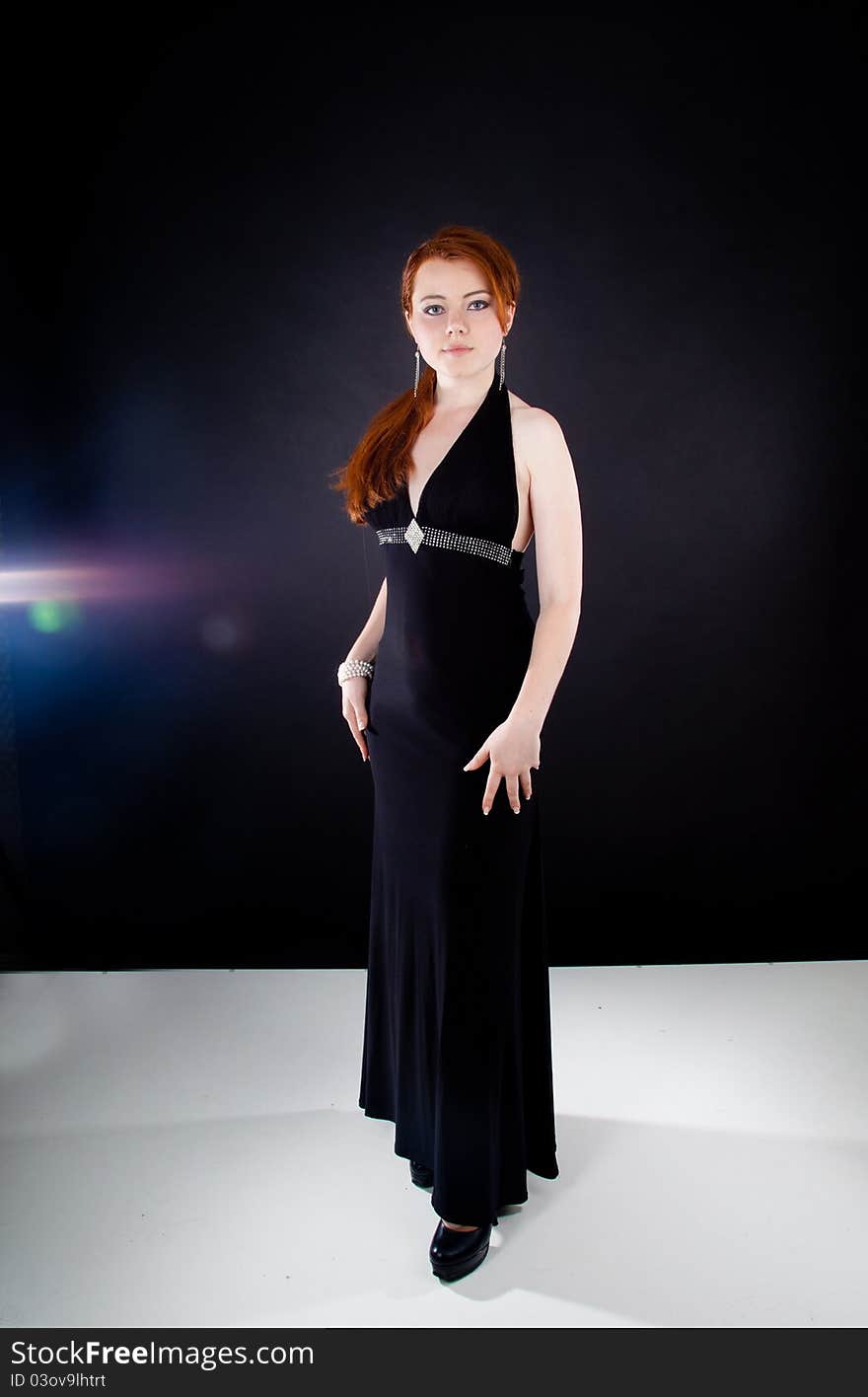 Studio shot of beautiful red haired woman