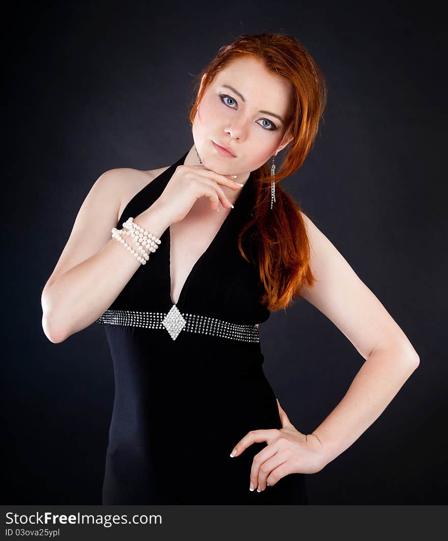 Studio shot of beautiful red haired woman