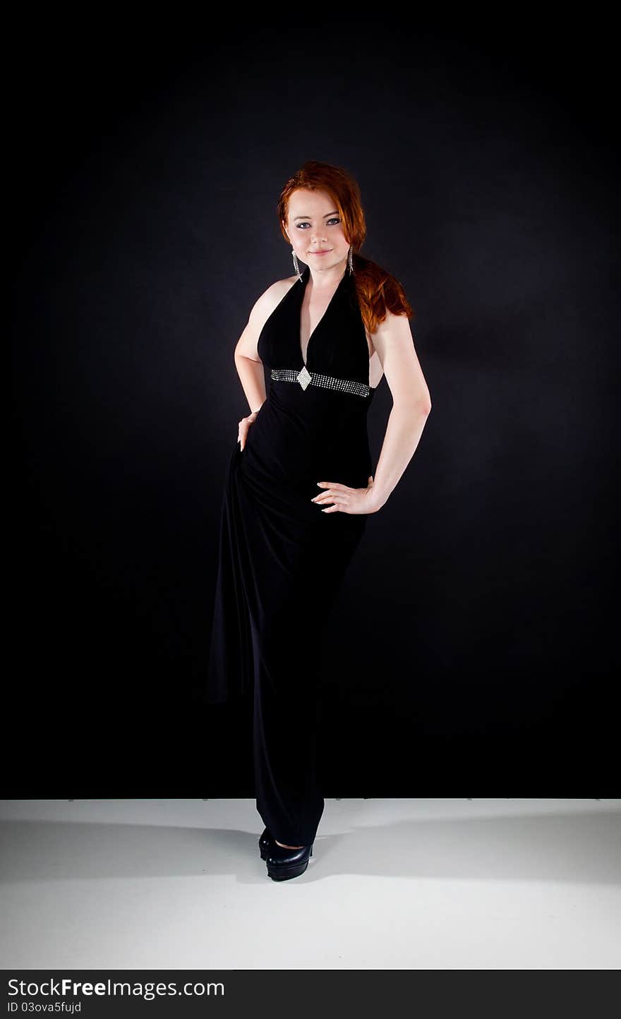 Studio shot of beautiful red haired woman