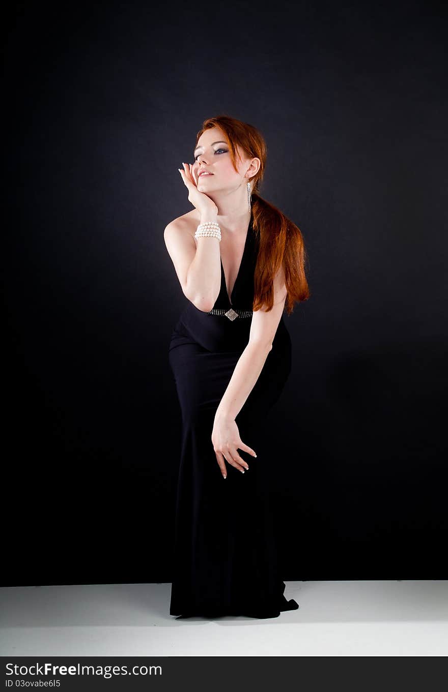 Studio shot of beautiful red haired woman