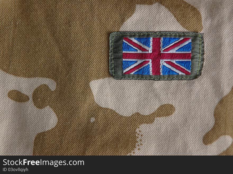 Closeup of british combat uniform with a flag