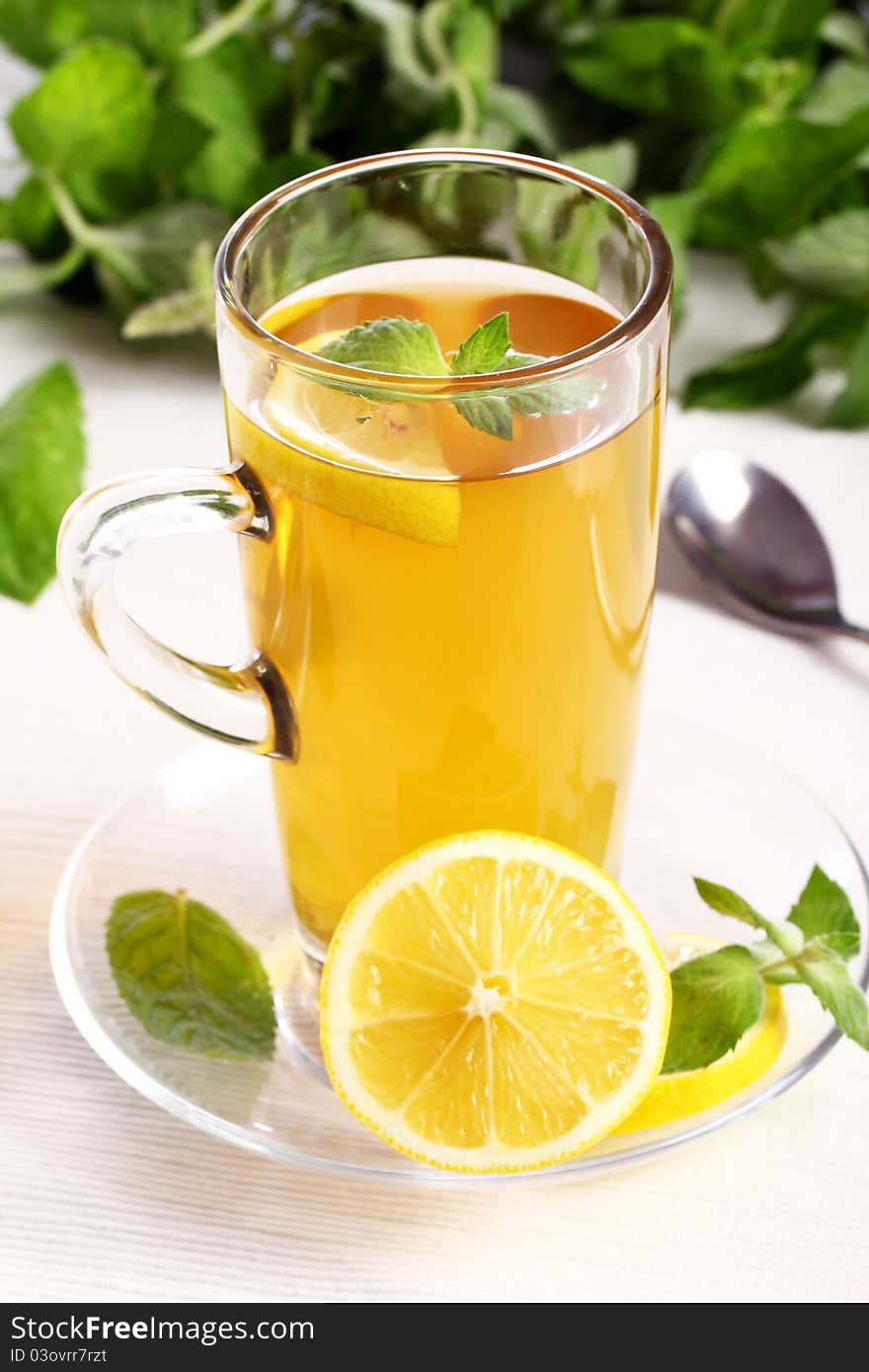 Cup of hot  tea with mint and lemon. Cup of hot  tea with mint and lemon